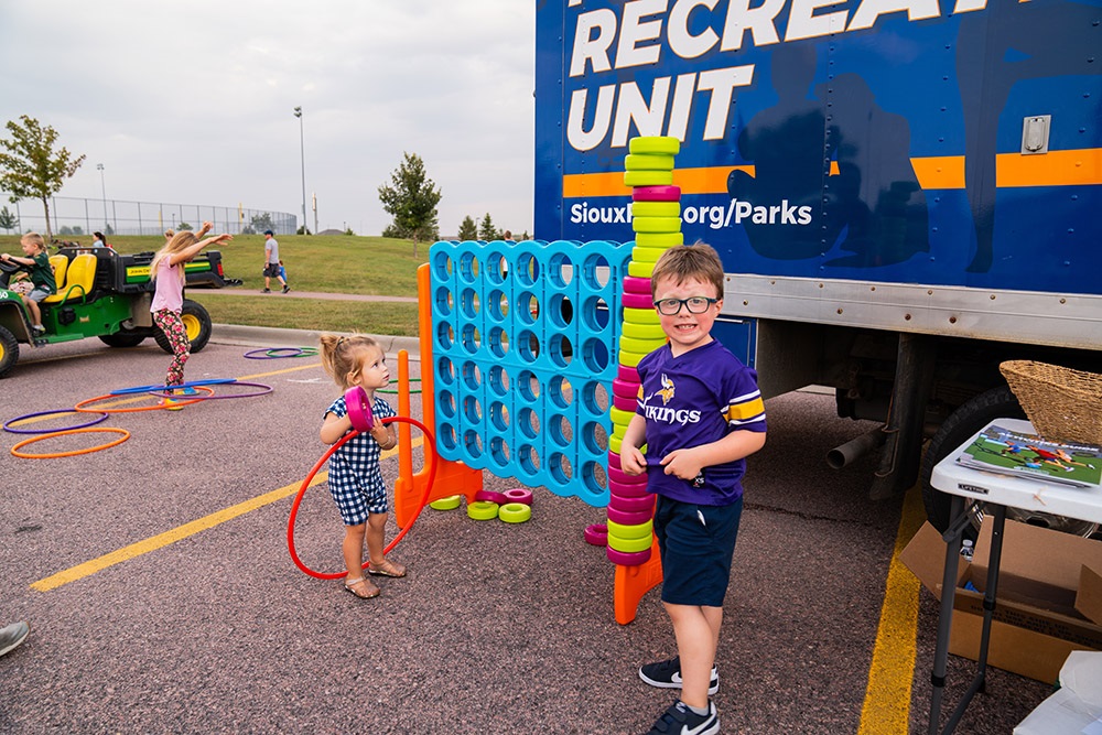 children playing games at the parks and rec mobile unit