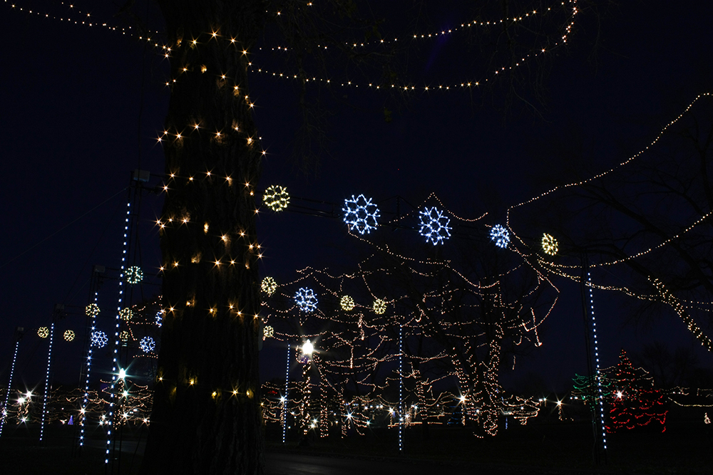 snowflake christmas lights lighting up the falls