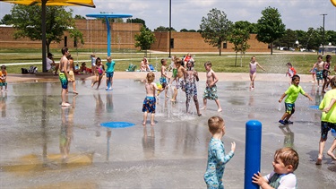 Children playing together at the hayward splash pad